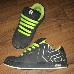 Green and black etnies